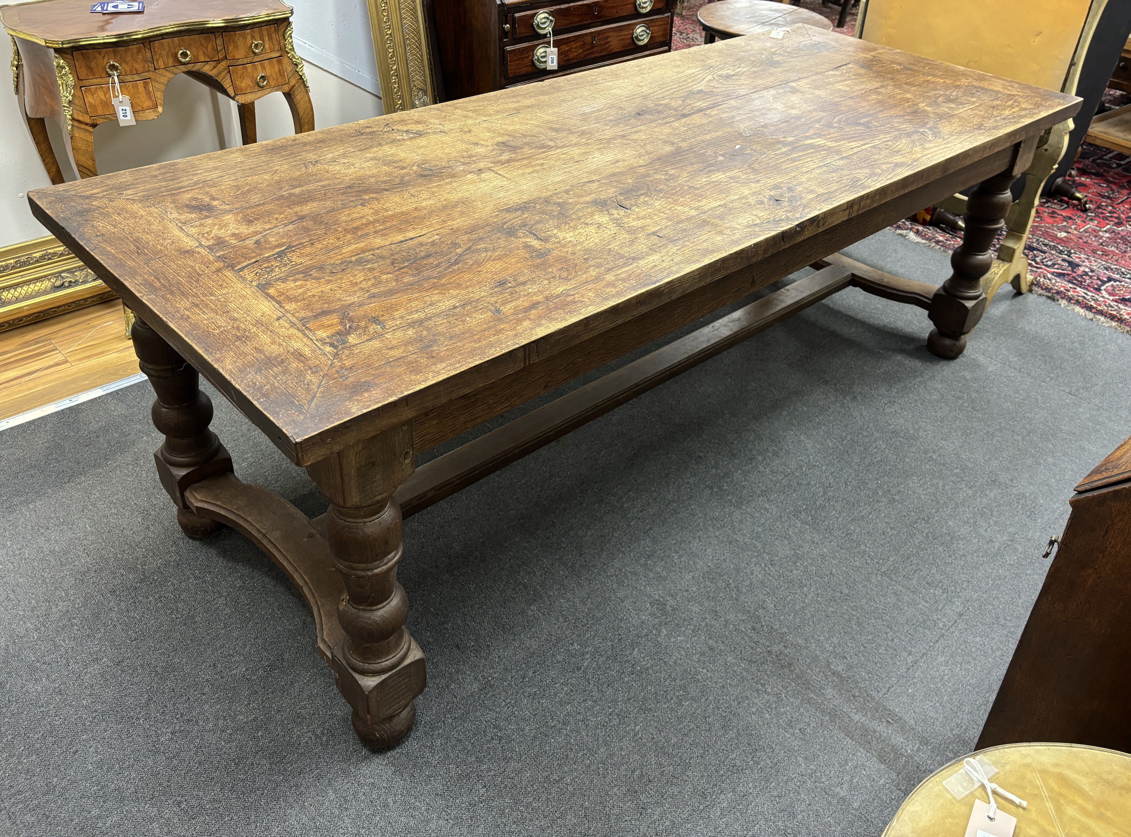 A rectangular oak refectory dining table, length 217cm, width 87cm, height 74cm